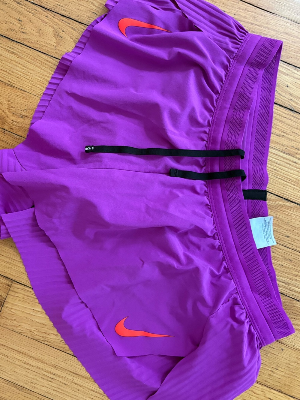 Nike Purple Athletic Shorts with Orange Swoosh